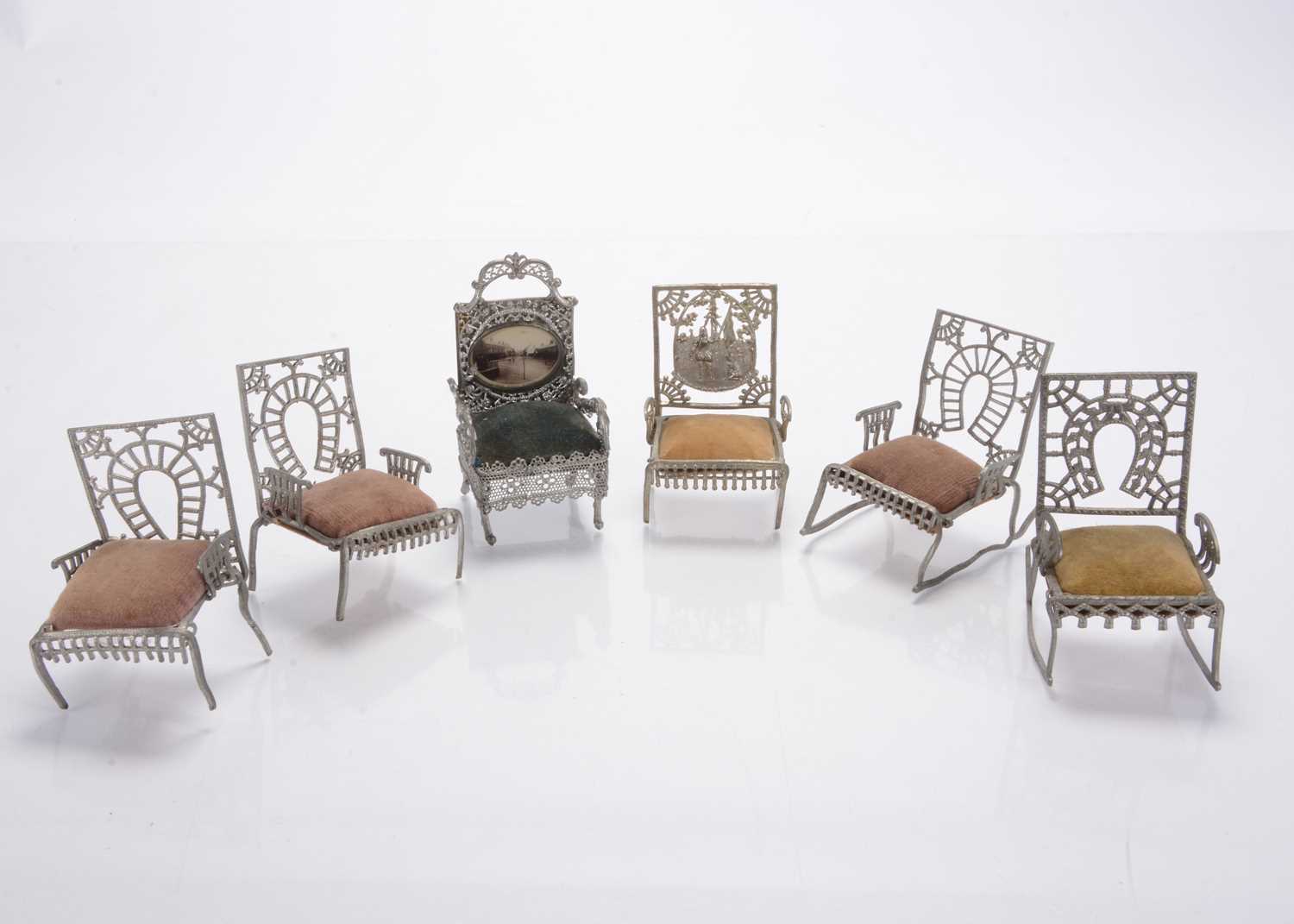 Lot 1115 - Five Adrian Cooke Metallic Works (Chicago) ‘The Fairy Furniture’ soft metal dolls’ house chairs