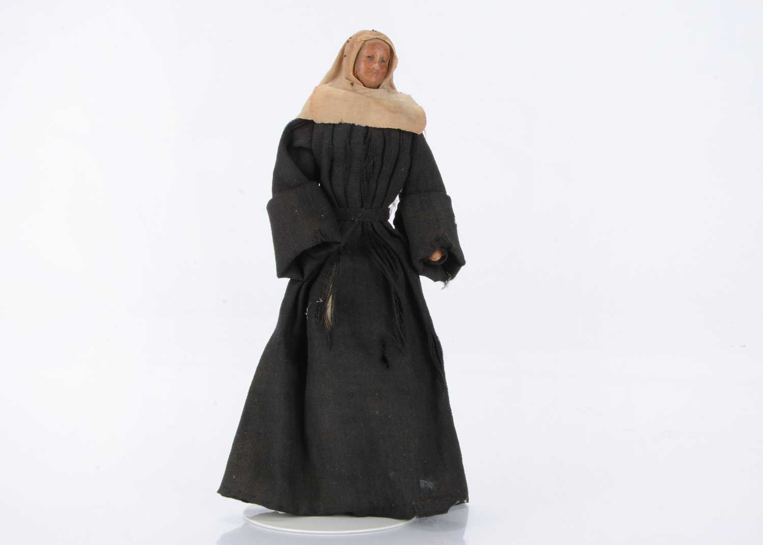 Lot 1340 - An early poured bees wax nun doll