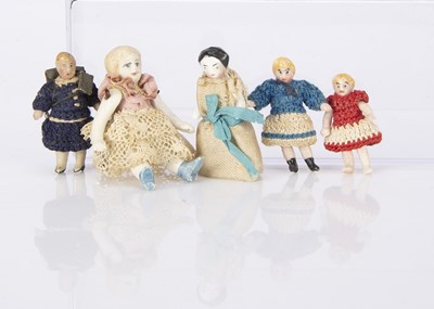 Lot 988 - Five tiny dolls’ house dolls