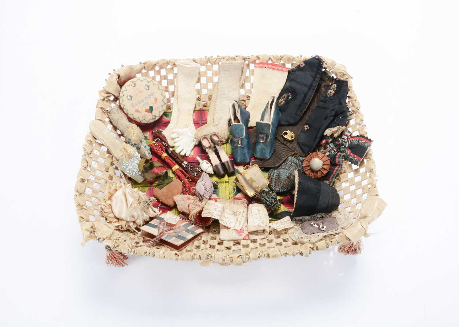 Lot 1458 - A mid 18th century English needlework and pin work basket containing an assortment of doll, sewing and miniature items