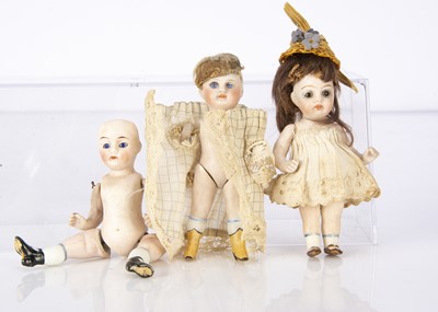 Lot 994 - Three all-bisque dolls’ house dolls