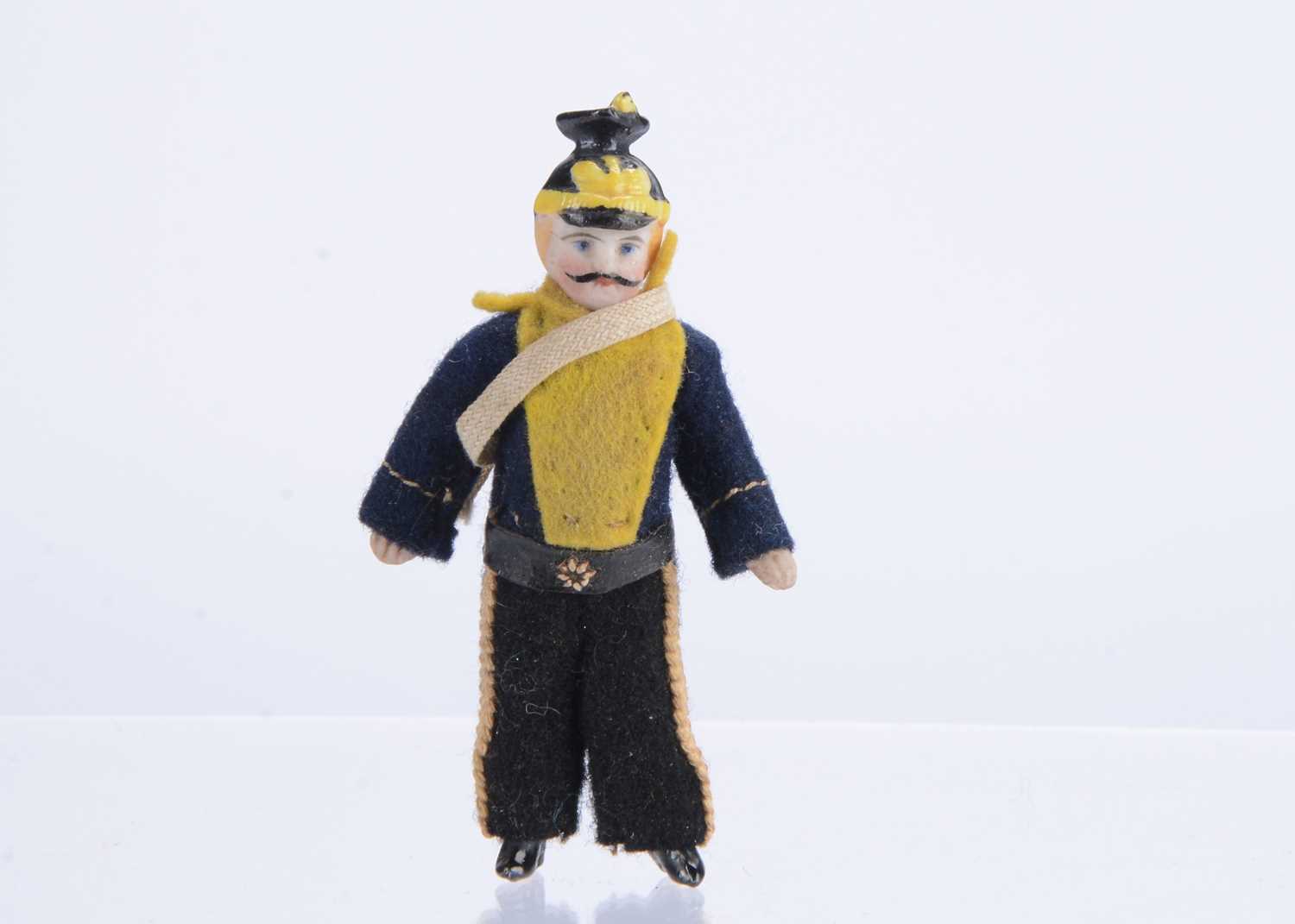 Lot 1508 - A late 19th all-bisque dolls’ house soldier doll