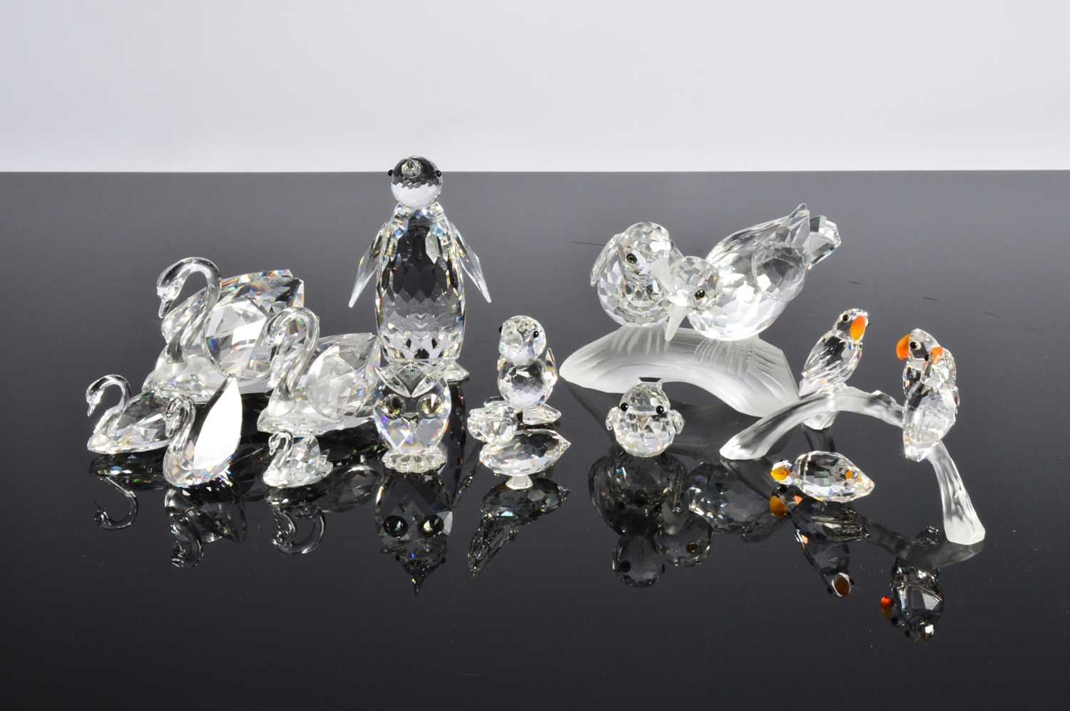 Lot 9 - A collection of twelve Swarovski birds