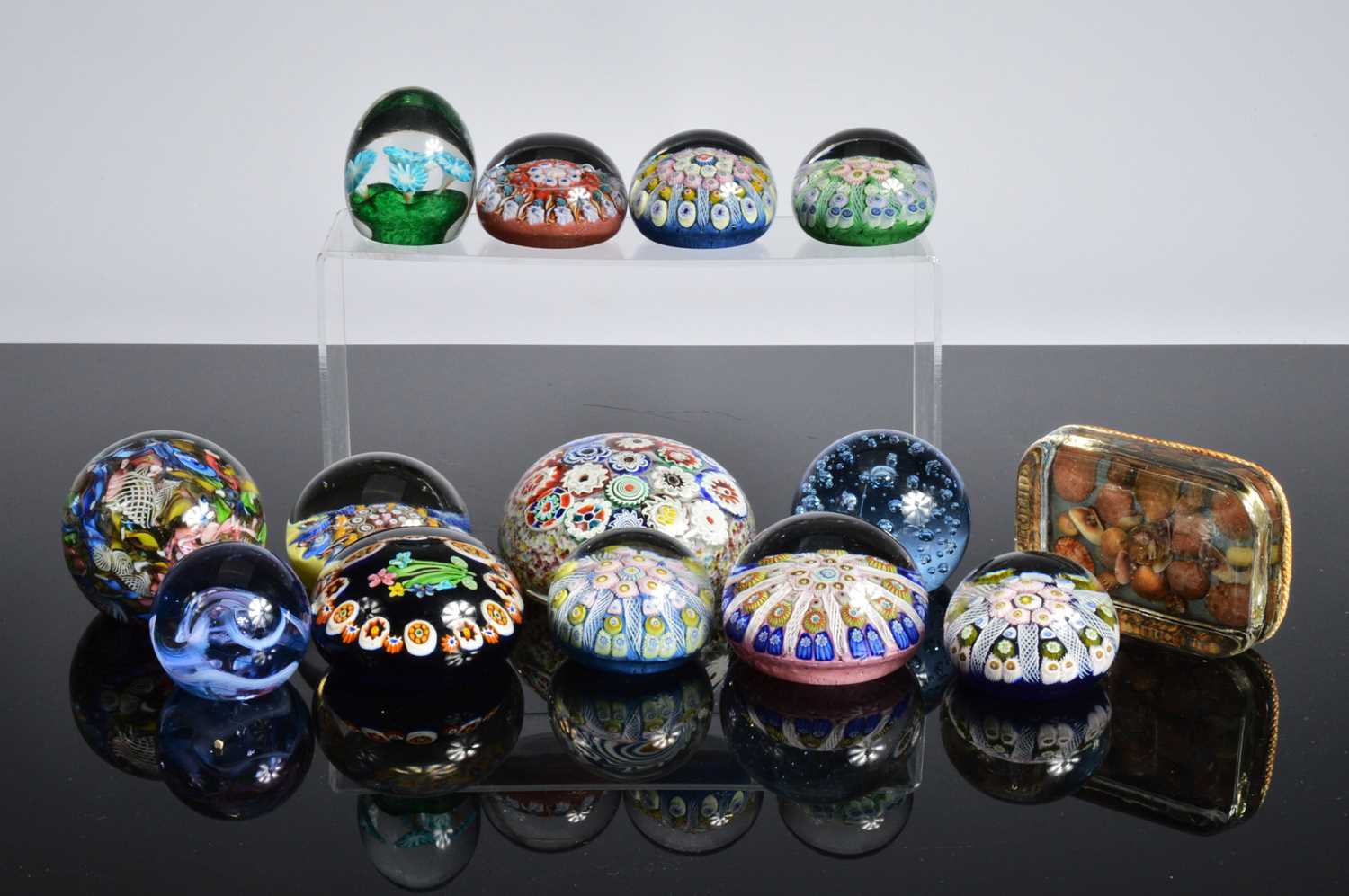 Lot 23 - A collection of glass paperweights