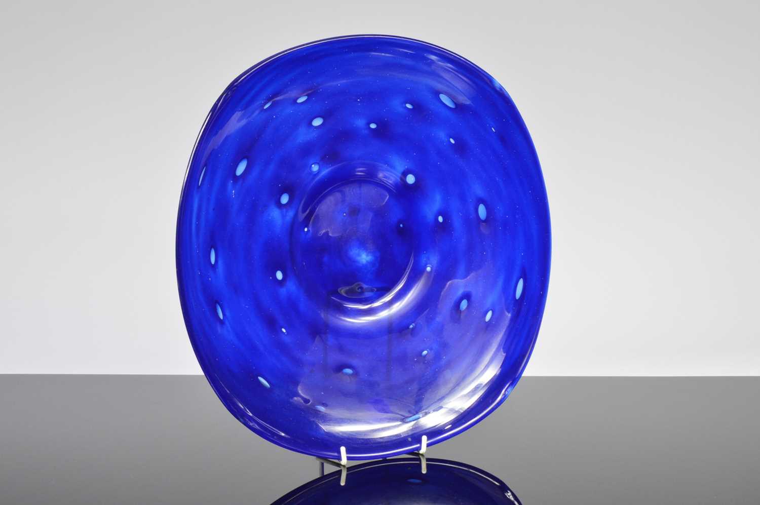 Lot 52 - An Art Deco blue glass charger by Charles Schneider