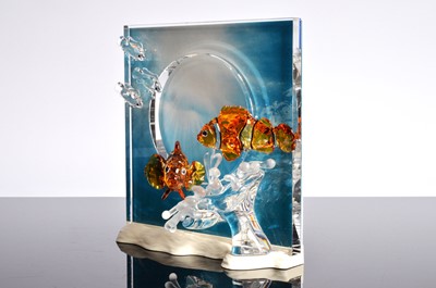 Lot 57 - A Swarovski Orange colored Clownfish over a frosted sea anemone