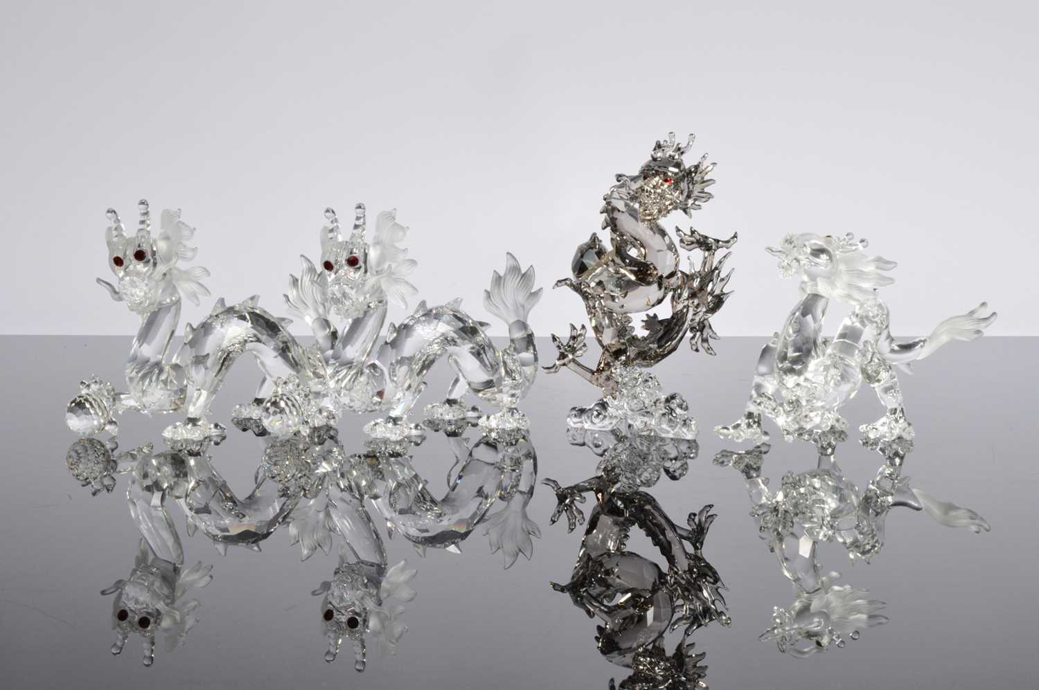 Lot 63 - Four Swarovski Dragon figures
