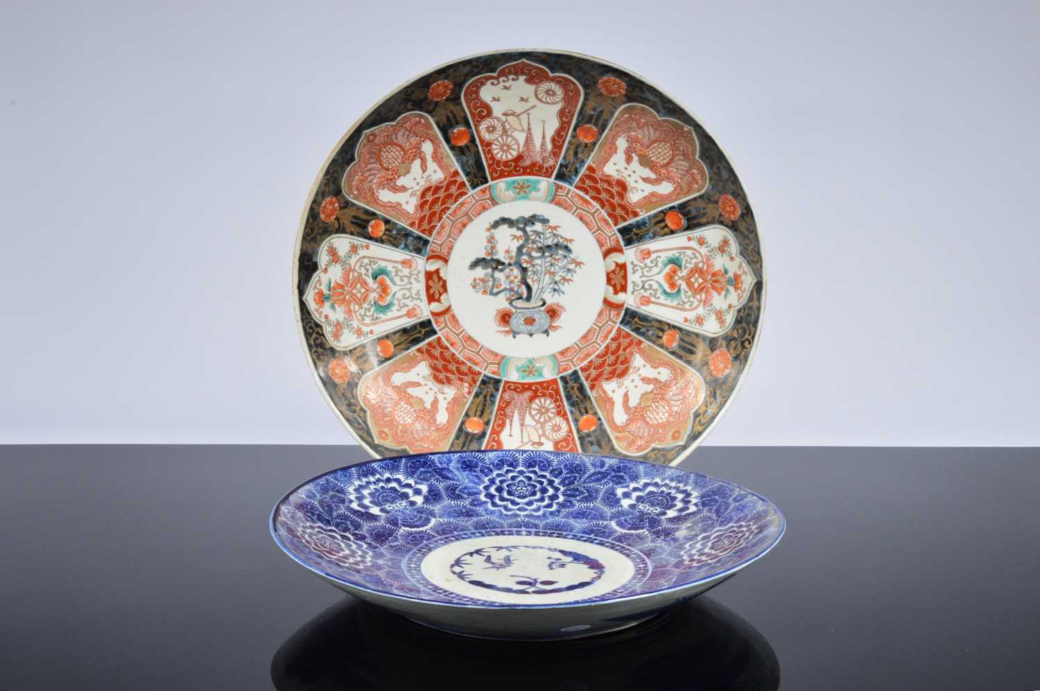 Lot 91 - A large 20th century Japanese porcelain Imari style charger and another Arita style example
