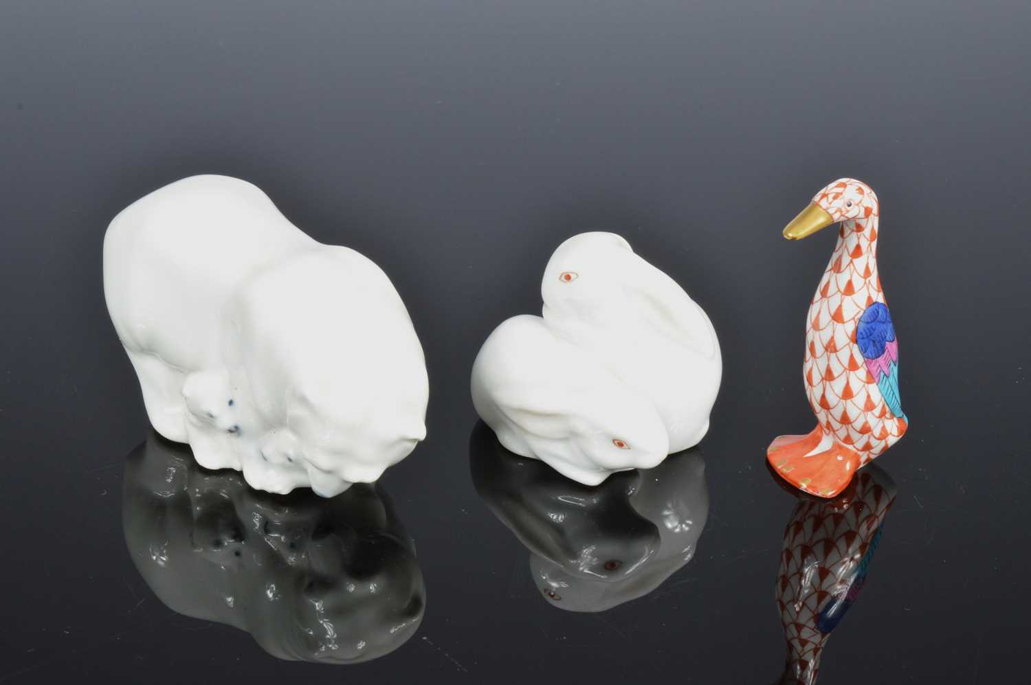 Lot 210 - Two small Herrend porcelain animals and a Royal Copenhagen porcelain polar bear group