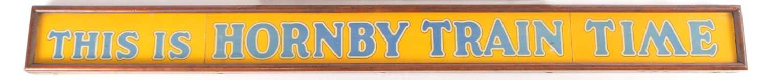 Lot 2 - Hornby 0 Gauge sign 'THIS IS HORNBY TRAIN TIME' possibly used by a shop