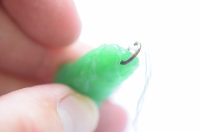 Lot 11 - A Chinese jadeite jade carved pendant