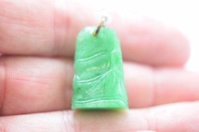 Lot 11 - A Chinese jadeite jade carved pendant