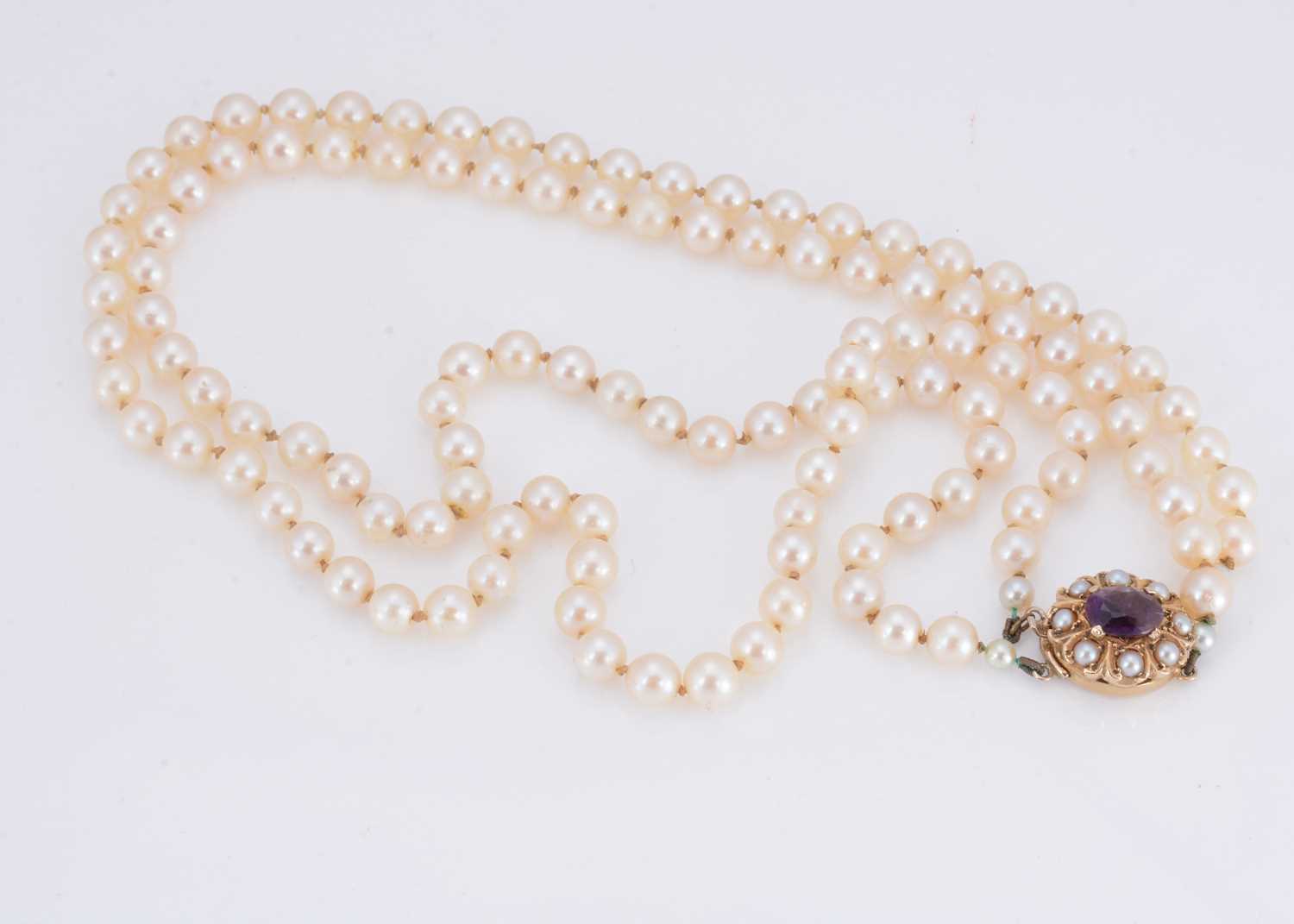 Lot 16 - A 9ct gold double row cultured pearl knotted twin set necklace
