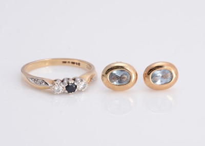 Lot 22 - A 9ct gold three stone diamond and sapphire dress ring