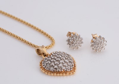 Lot 23 - An 18ct gold diamond heart shaped pendant