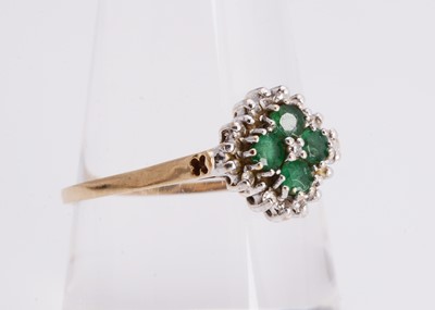 Lot 24 - An emerald and diamond 9ct gold cluster ring
