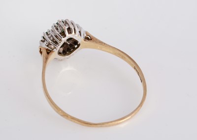 Lot 24 - An emerald and diamond 9ct gold cluster ring