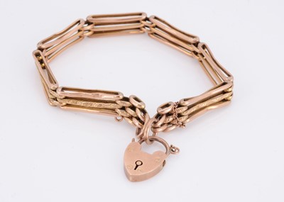 Lot 26 - A three bar gate link bracelet with padlock clasp