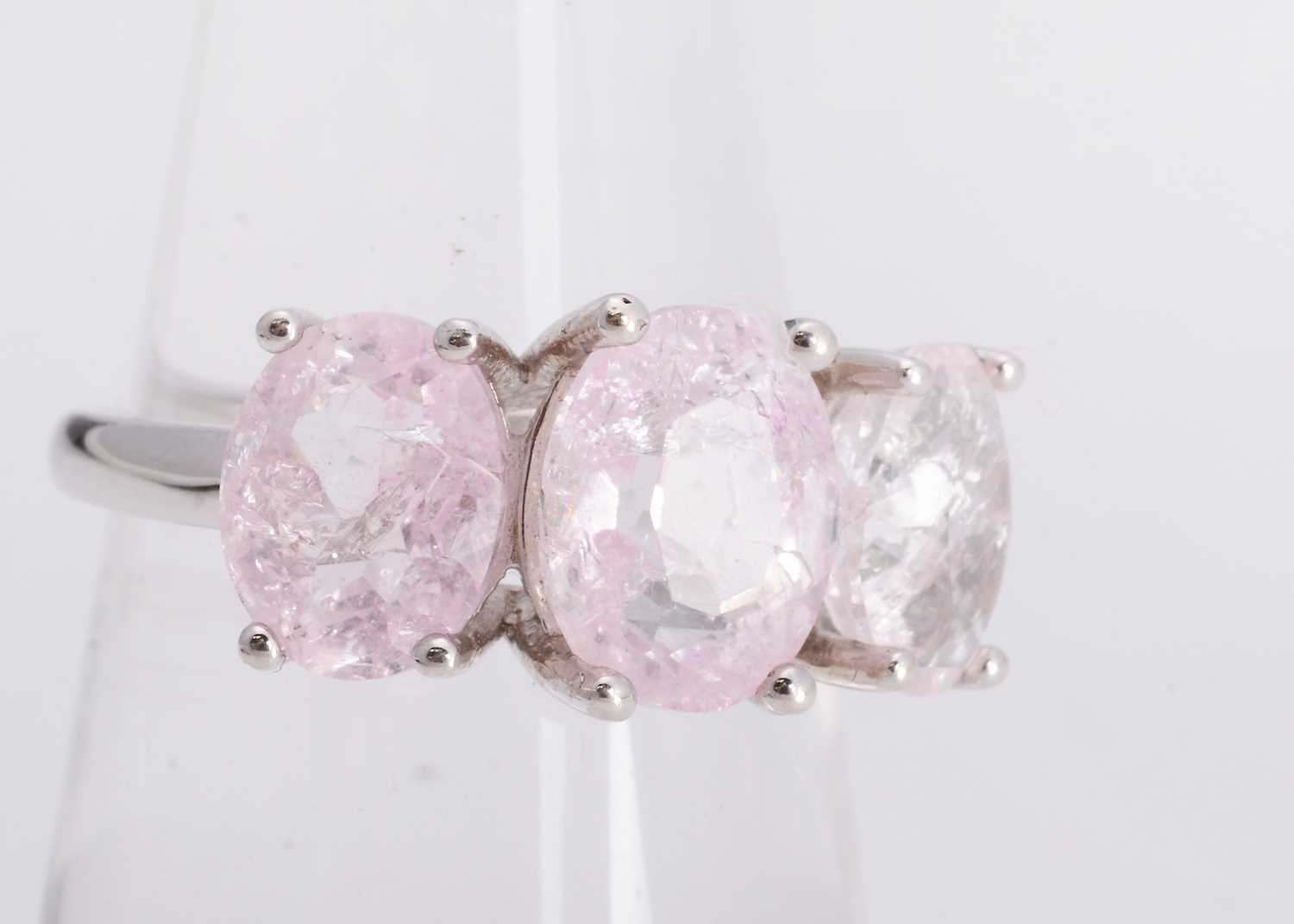 Lot 49 - A certificated silver purple crackled quartz three stone dress ring