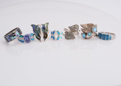 Lot 54 - Seven opal, abalone and gem set dress rings
