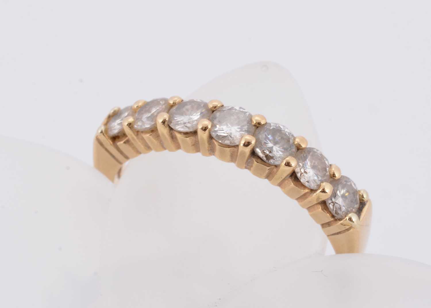 Lot 56 - An 18ct gold seven stone diamond dress ring