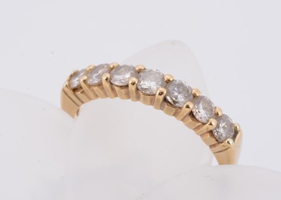 Lot 56 - An 18ct gold seven stone diamond dress ring