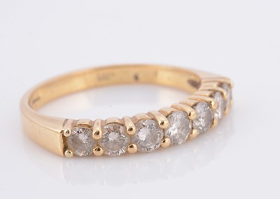 Lot 56 - An 18ct gold seven stone diamond dress ring