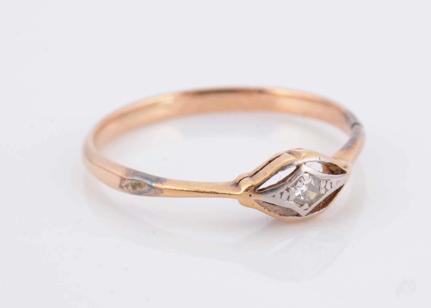 Lot 57 - An art deco 18ct gold and platinum set diamond dress ring