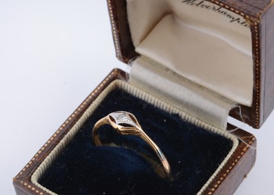 Lot 57 - An art deco 18ct gold and platinum set diamond dress ring