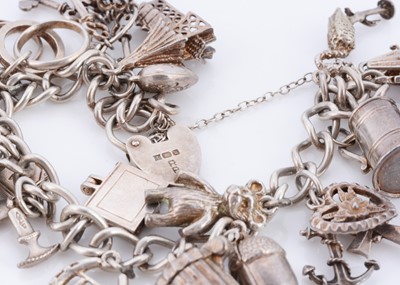 Lot 61 - A silver charm bracelet