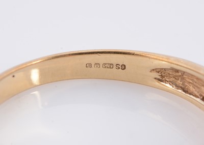 Lot 63 - A channel set sapphire and diamond half hoop 9ct gold dress ring