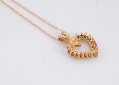 Lot 64 - A 10ct gold diamond set heart pendant and chain