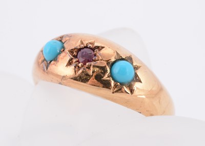 Lot 66 - A three stone Edwardian 18ct gold ruby and turquoise dress ring