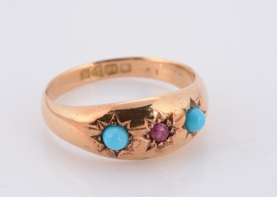Lot 66 - A three stone Edwardian 18ct gold ruby and turquoise dress ring