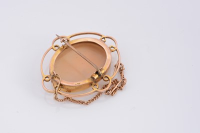 Lot 67 - A 9ct gold oval carved shell cameo brooch