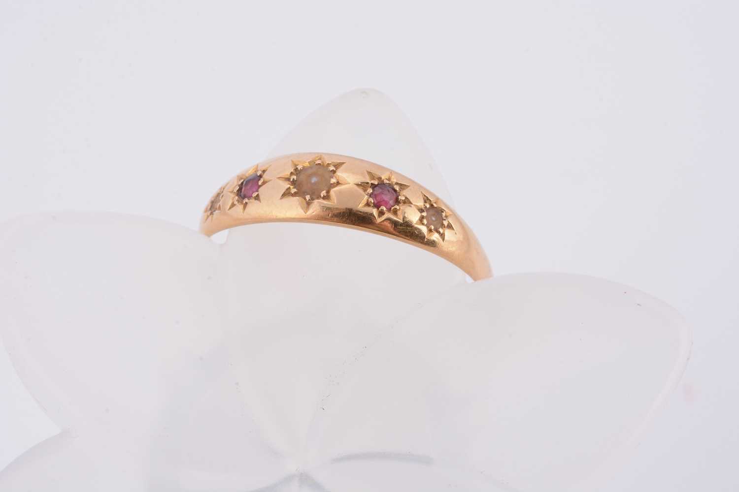 Lot 70 - An 18ct gold ruby and pearl dress ring