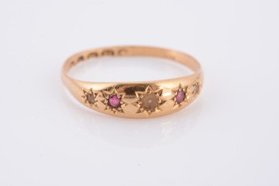 Lot 70 - An 18ct gold ruby and pearl dress ring