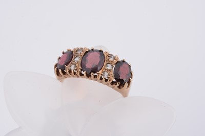 Lot 71 - A 9ct gold garnet and white topaz dress ring