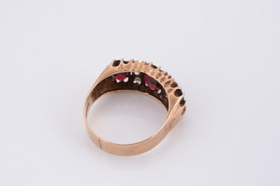 Lot 71 - A 9ct gold garnet and white topaz dress ring