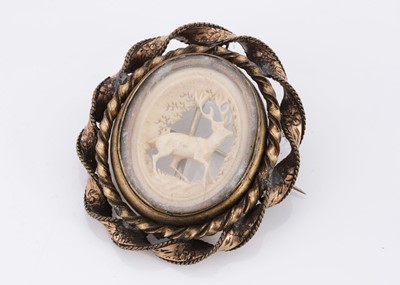 Lot 80 - A 19th Century gilt metal antler carved brooch