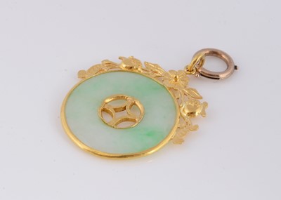 Lot 96 - A Chinese high carat jadeite jade disc pendant
