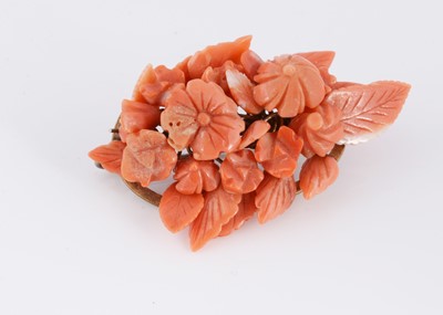 Lot 97 - A 19th Century Southern Italian carved coral ovoid brooch