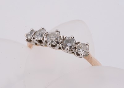 Lot 103 - An 18ct gold platinum set five stone diamond graduated dress ring