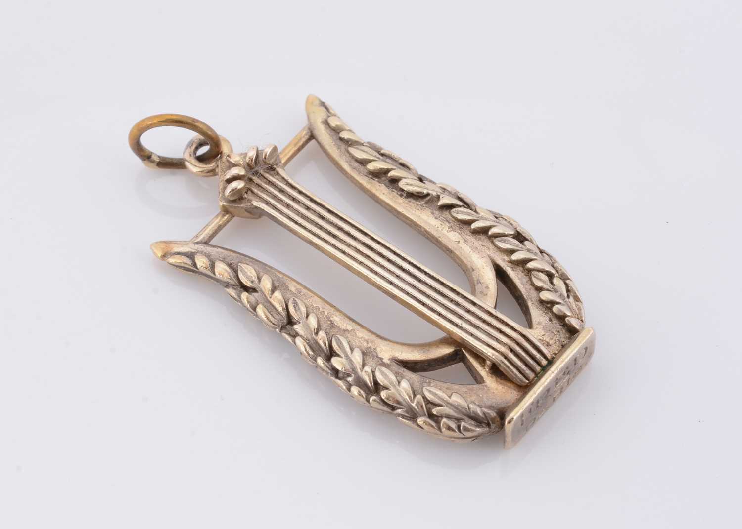 Lot 112 - A Fred of Paris Gaetan de Percin silver lyre charm