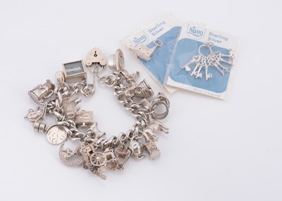 Lot 125 - A silver charm bracelet