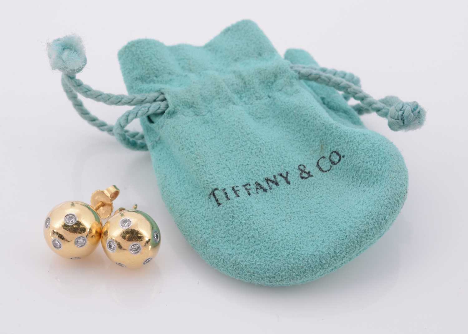 Lot 126 - A pair of Tiffany & Co 18ct gold platinum and diamond set Etoile ear studs