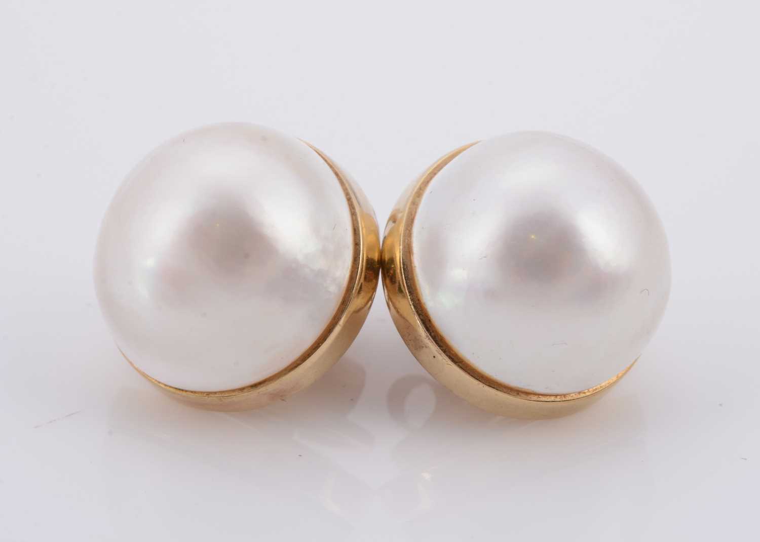 Lot 132 - A pair of mabe pearl ear studs