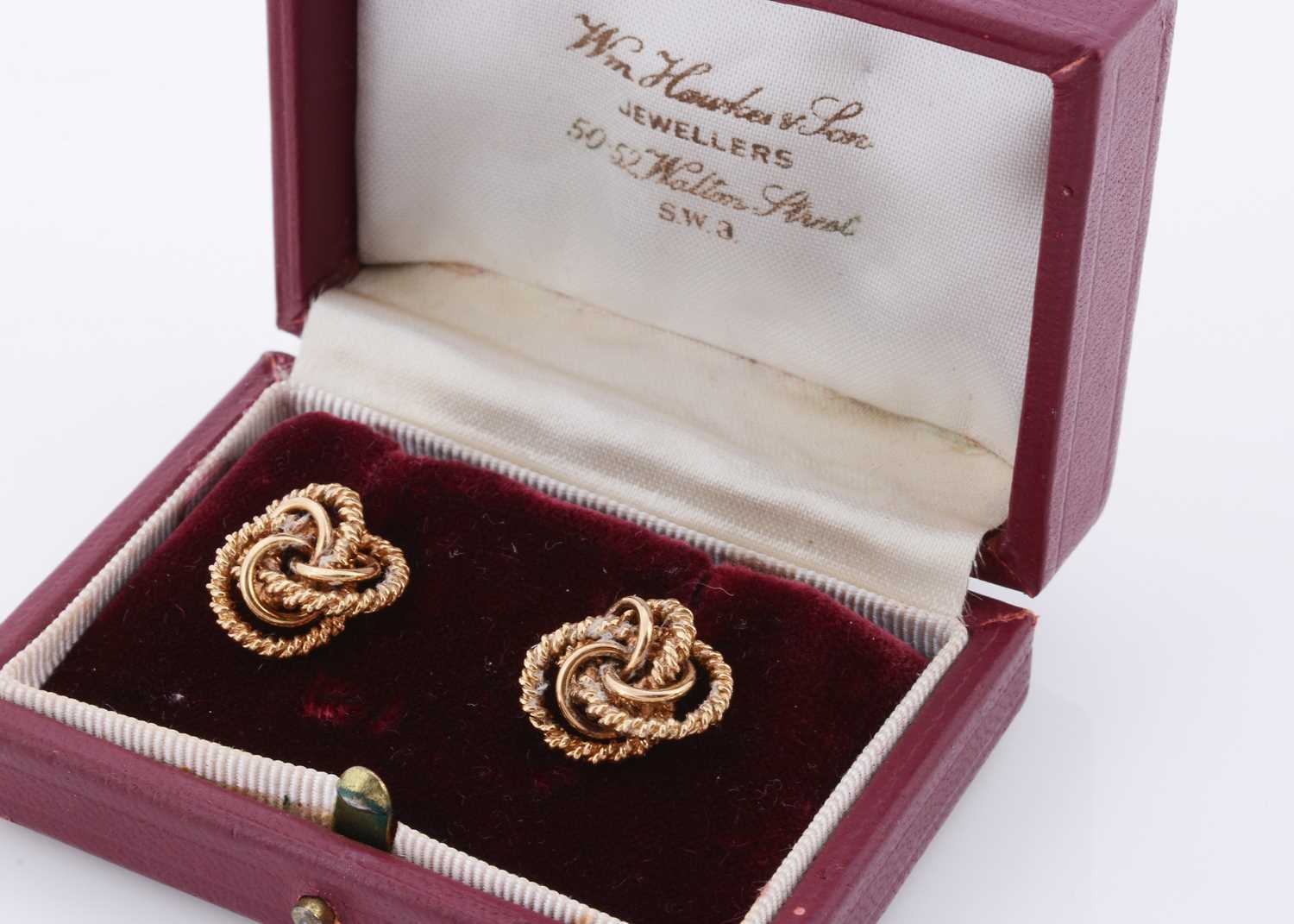 Lot 135 - A pair of cased textured knot 9ct gold earrings
