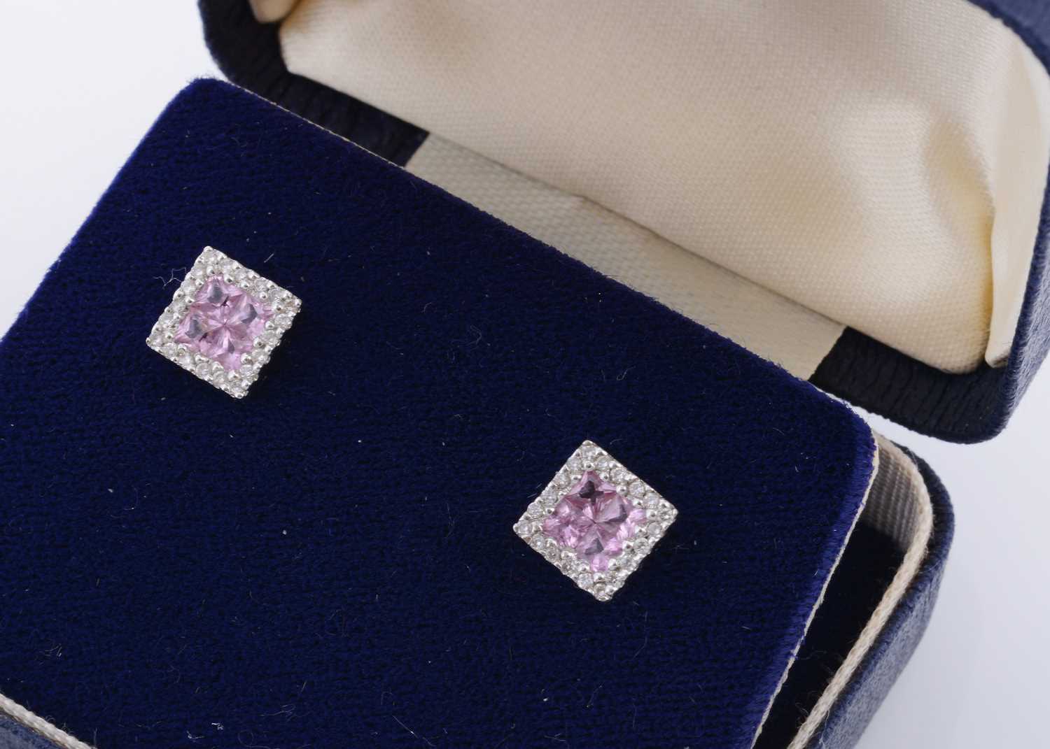 Lot 137 - A pair of 18ct gold pink sapphire and diamond set square stud earrings