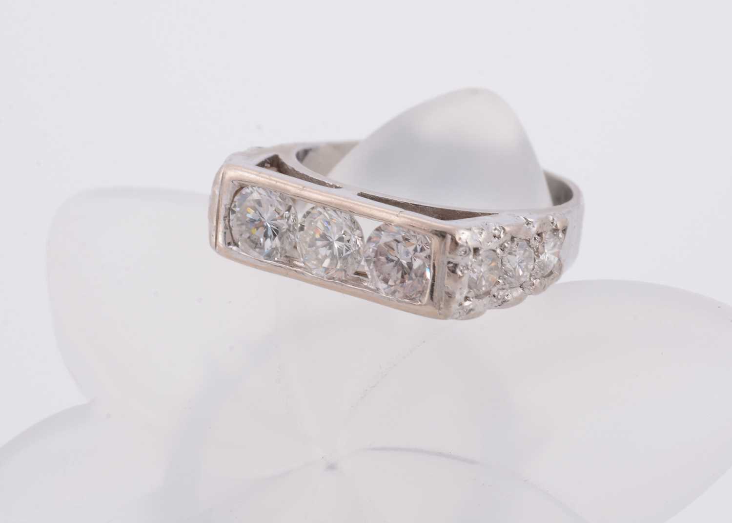 Lot 144 - A three stone diamond set 18ct white gold lady's dress ring